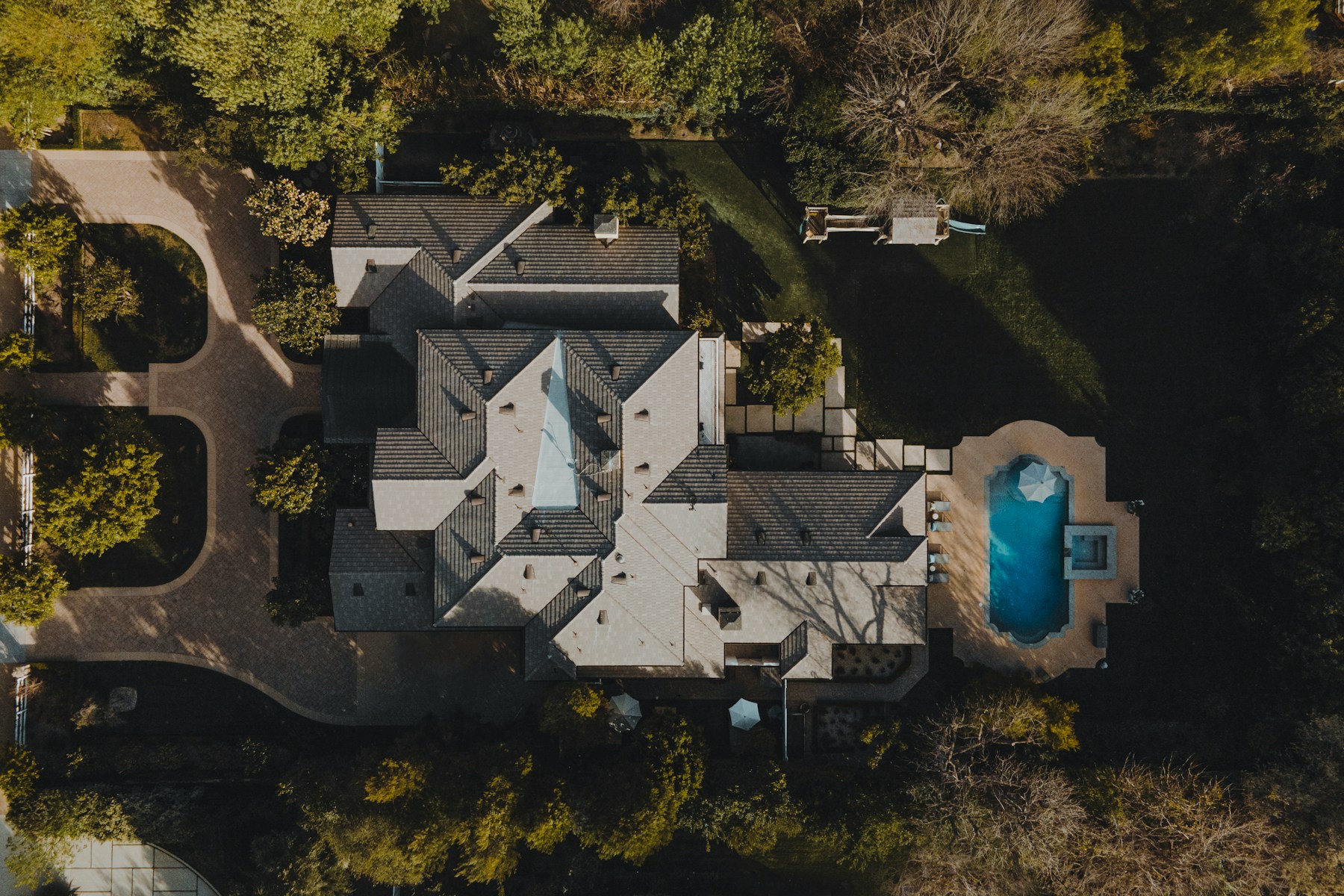 Top-down aerial of a private California residence with landscaped grounds and swimming pool
