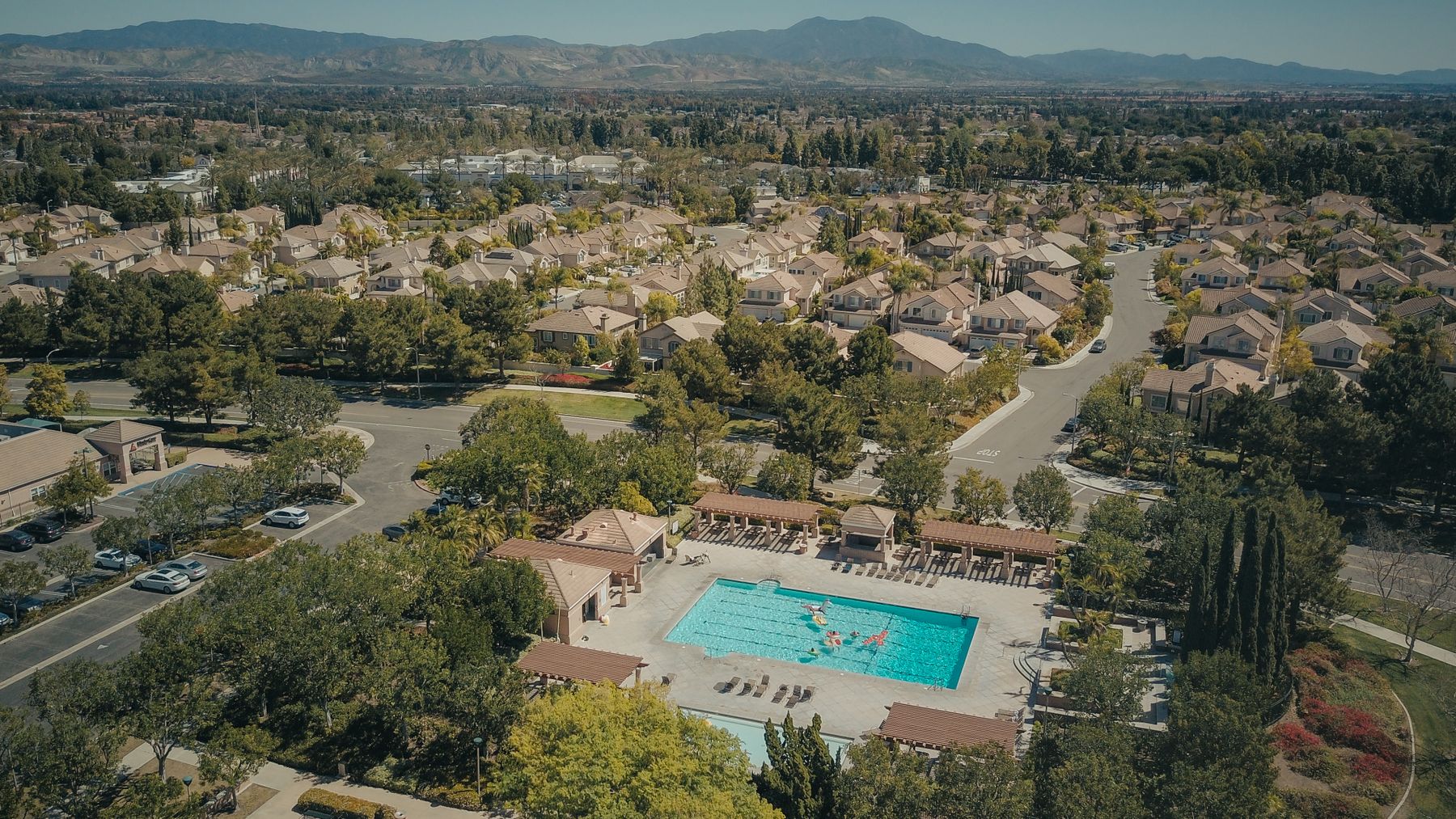 California residential community and pool framed by distant mountains