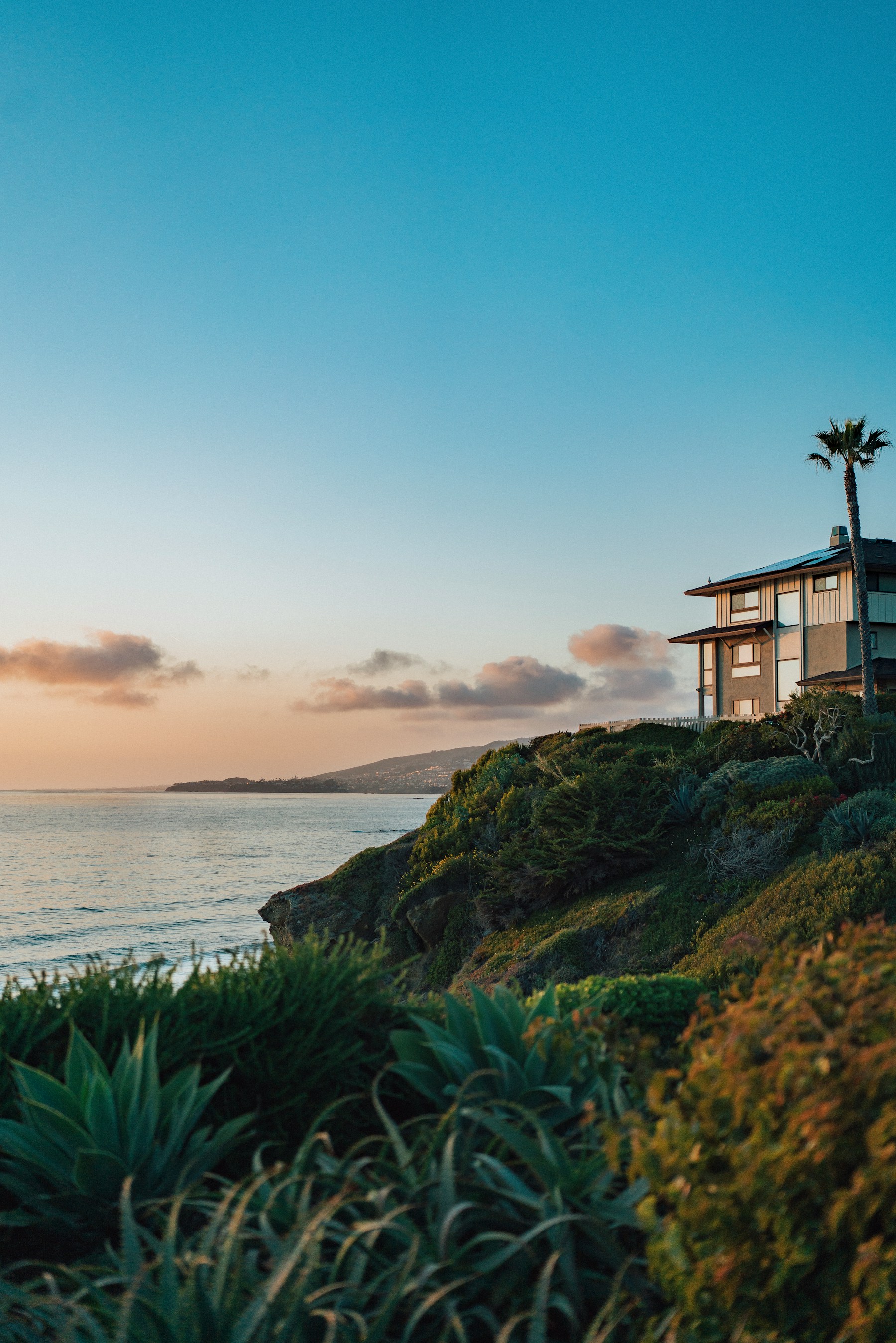 Laguna Beach residence perched above the Pacific in warm evening light